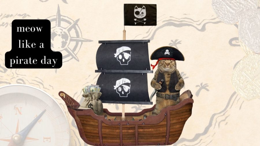 cat in pirate suit standing on toy pirate ship in graphic for Meow Like a Pirate Day
